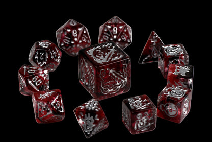 Set of red and black dice with intricate designs on a black background